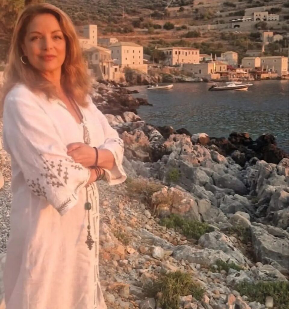 Photo by Angela Gerekou official on July 28 2024. May be an image of 1 person Santorini and coast