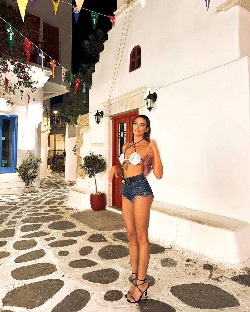 Photo by Irida Konstantina Papoutsi on July 07 2024. May be an image of 1 person shorts and Santorini. 1 1