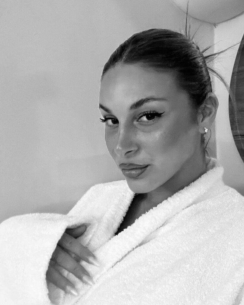 Photo by Xrysa Xatzigeorgiou on June 28 2024. May be a black and white image of 1 person blonde hair makeup robe and bath robe