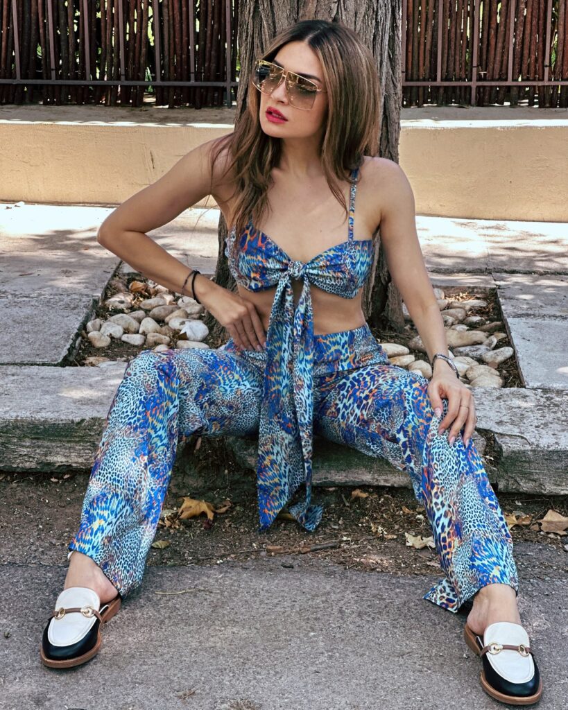 Photo shared by Apostolia Zoi Official on July 18 2024 tagging @carranogreece and @2xmofficial. May be an image of 1 person espadrilles eyewear slingback shoes and jumpsuit