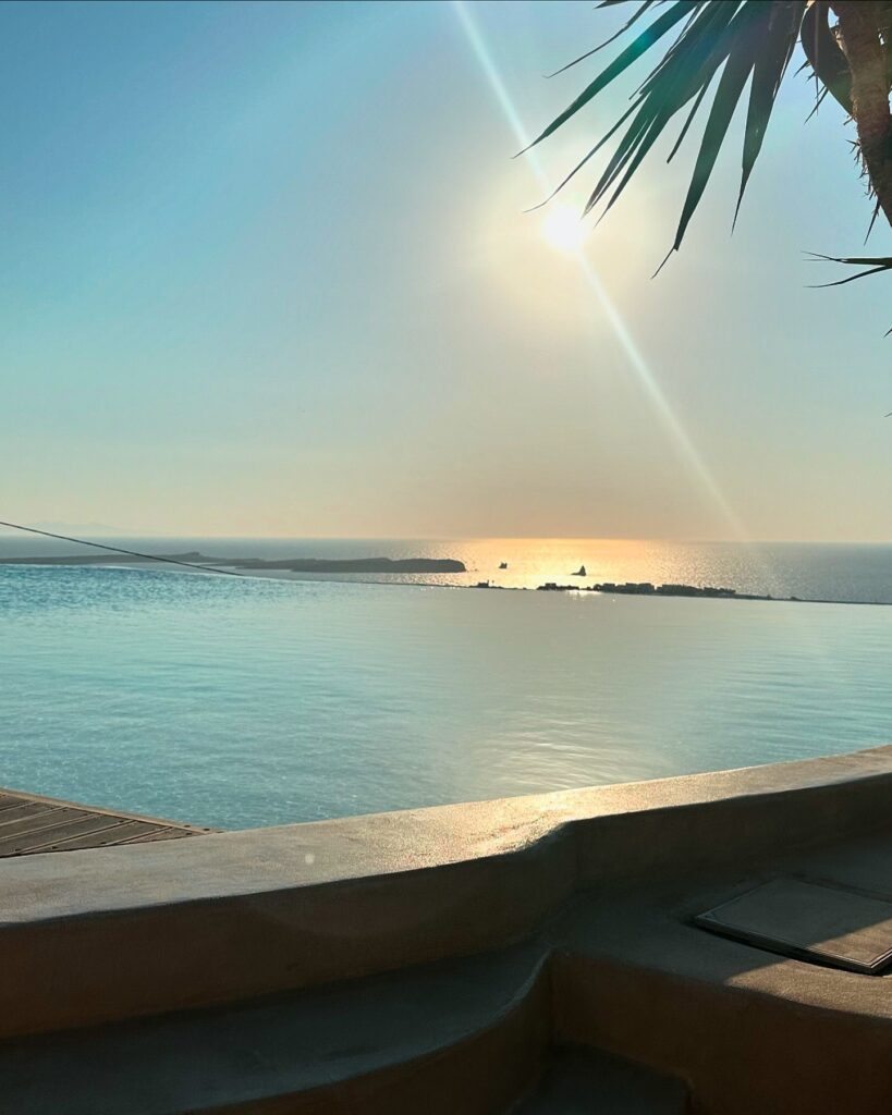 Photo shared by Katerina Kainourgiou Official on July 12 2024 tagging @mythicparos. May be an image of ocean horizon twilight pool palm trees and coast